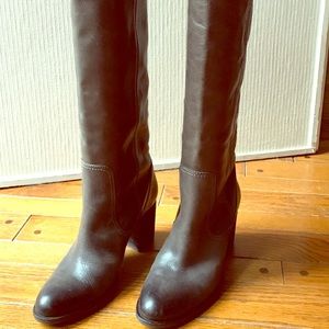 Knee high grey leather boots.